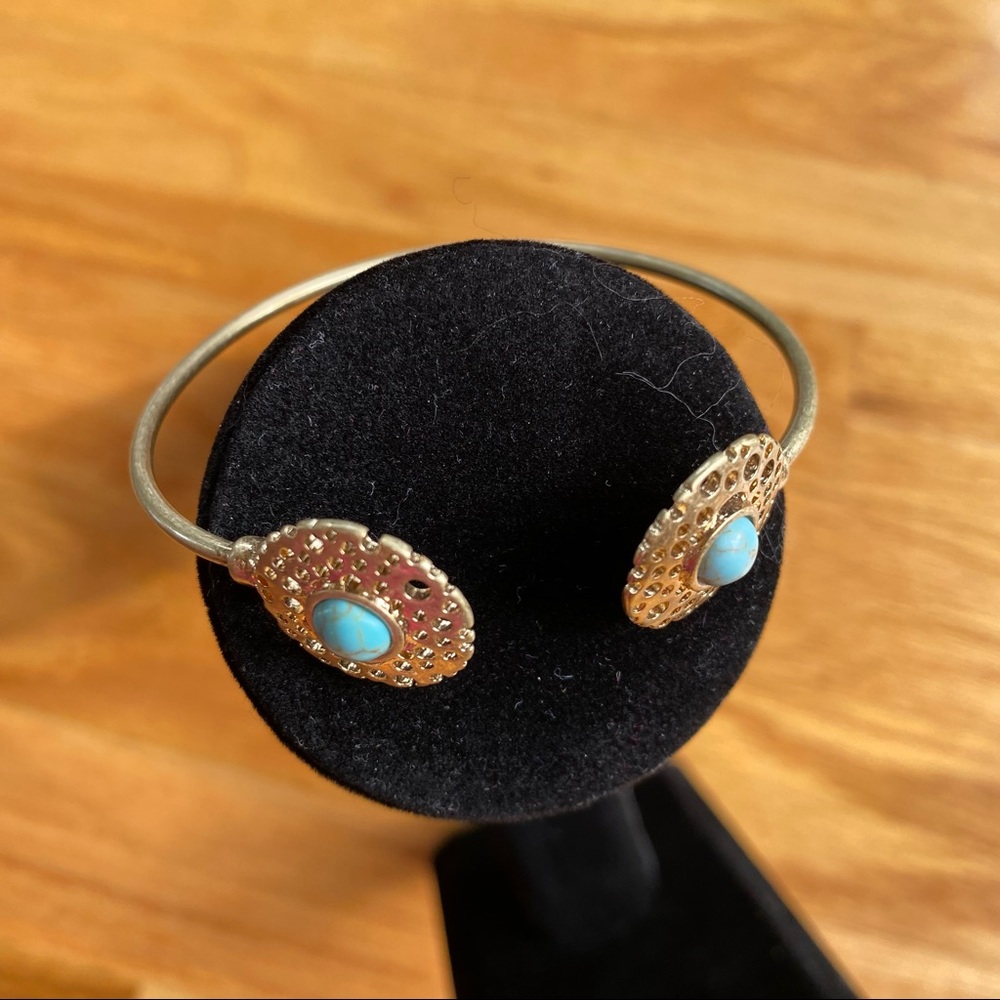 Gold color and turquoise color bracelet